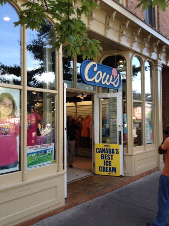  Storefront with 'Cow's' ice cream sign and a sign that reads "Canada's best ice cream"